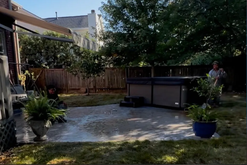 Fresh sod lawn and concrete patio installation in a Middle Tennessee backyard